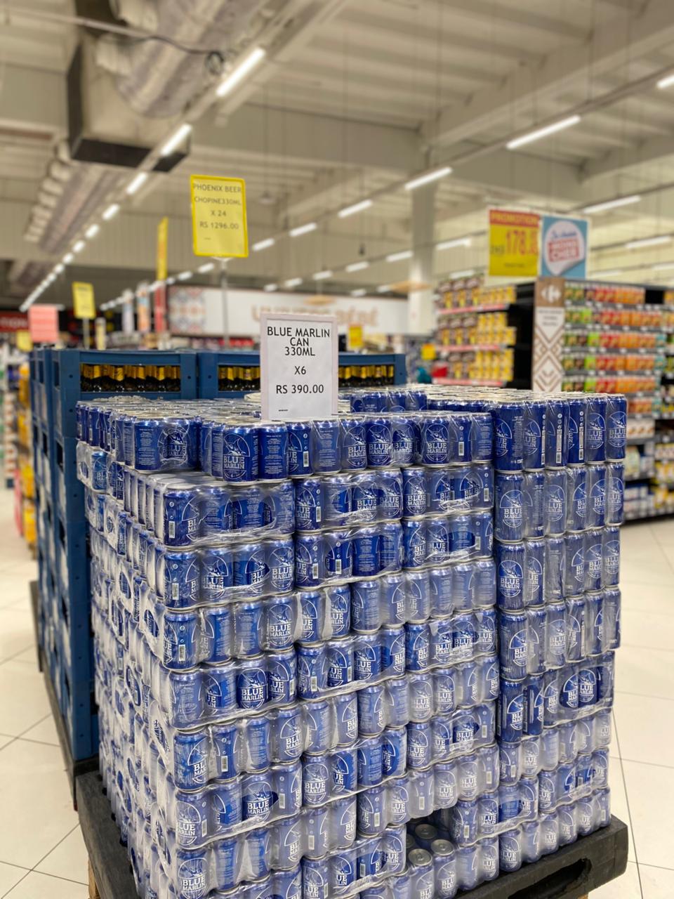 May be an image of drink and text that says "PHOENEX BEER CHOPONE X24 s 1296.00 BLUEMARLIN BLUE MARLIN 330ML RS 390.00 390."