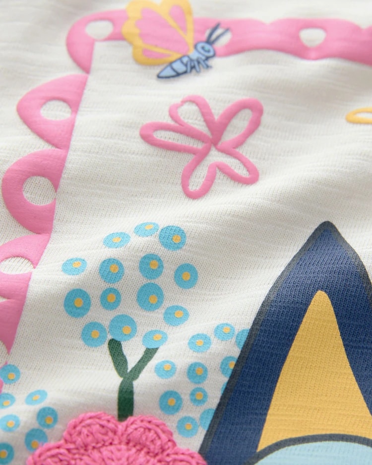 May be an image of sleepwear and text