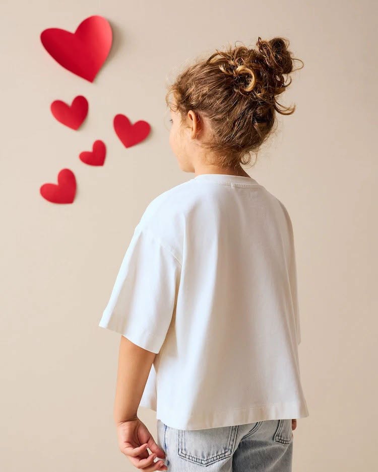 May be an image of child, heart and sleepwear